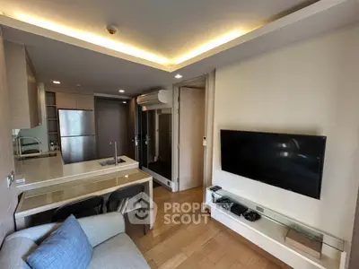 Modern living room with open kitchen and sleek design