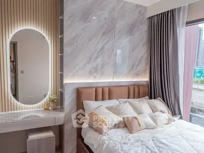 Luxurious bedroom with modern decor and city view, featuring elegant lighting and plush bedding.