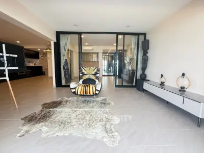 Spacious modern living room with stylish decor and open layout, perfect for contemporary living.