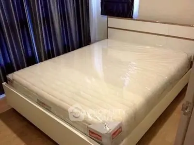 Modern bedroom with new mattress and stylish curtains