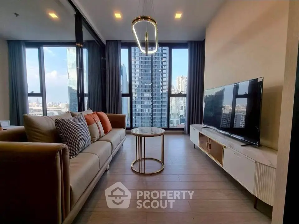 Luxurious modern living room with stunning city view, featuring elegant furniture and floor-to-ceiling windows.