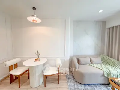 Chic modern living room with cozy sofa and elegant dining area