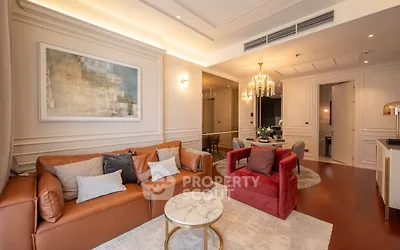 Luxurious living room with elegant decor, plush seating, and ambient lighting in a modern apartment.