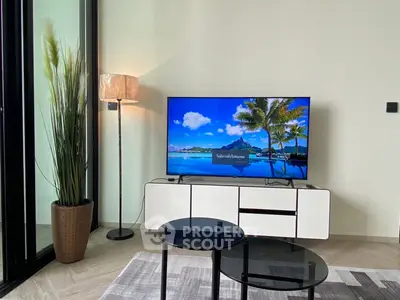 Modern living room with sleek TV setup and stylish furniture