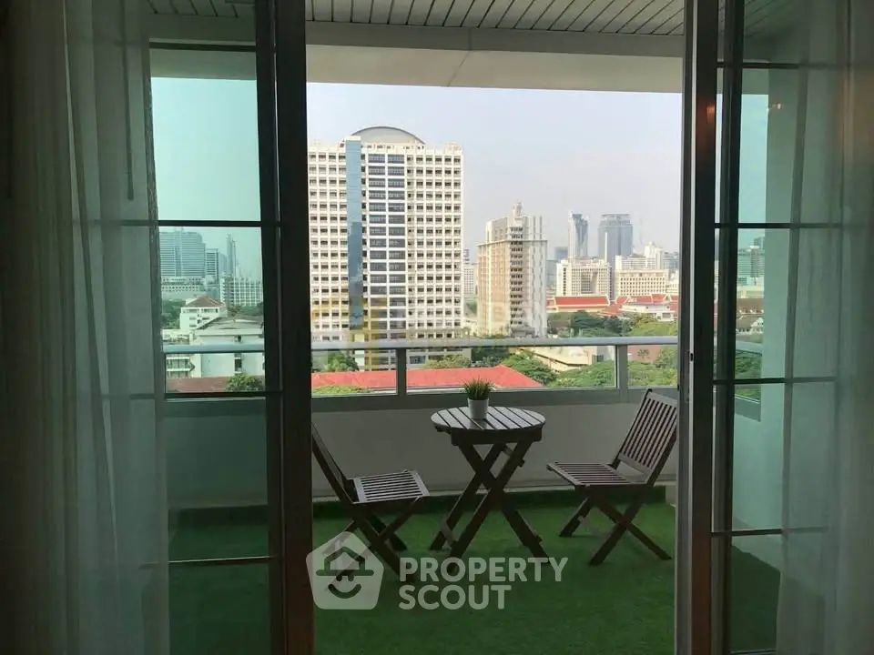 Charming balcony with city view, perfect for relaxation and enjoying the skyline.