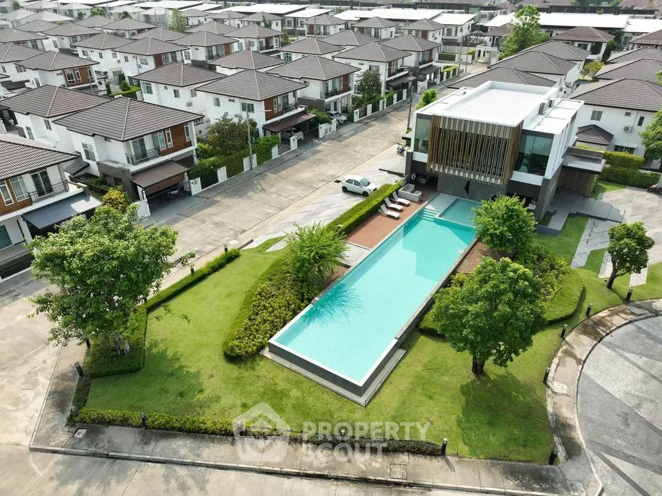 Luxurious residential community with modern houses and a stunning pool