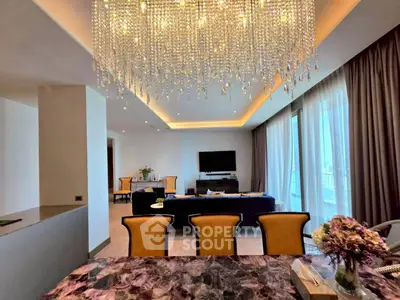 Luxurious living room with elegant chandelier and spacious seating area