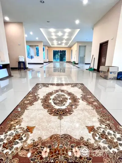 Spacious modern living room with elegant tiled flooring and recessed lighting