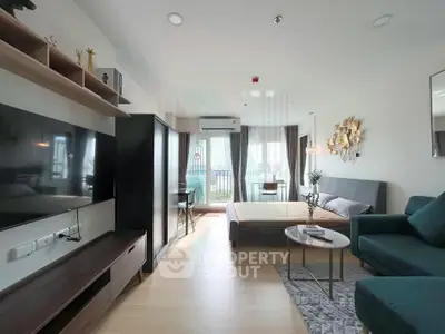 Modern studio apartment with stylish decor and balcony view