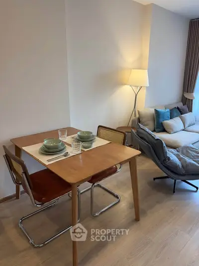 Modern living room with cozy dining area and stylish decor