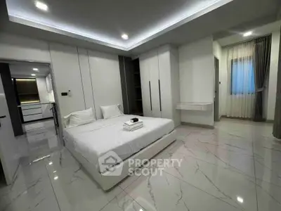 Luxurious modern bedroom with sleek design and elegant lighting