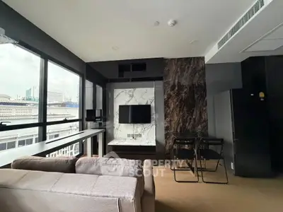 Modern living room with large windows and stylish decor in urban apartment