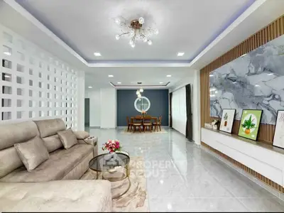 Spacious modern living room with elegant decor and open layout, perfect for family gatherings.