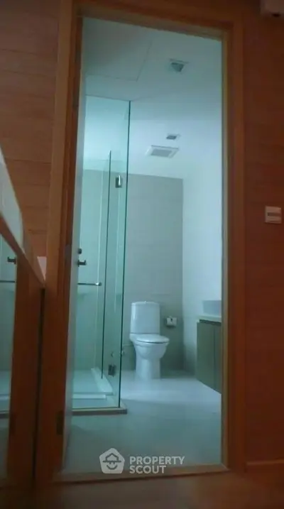 Modern bathroom with glass shower and sleek fixtures