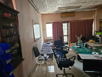 Spacious home office with natural light and modern furniture