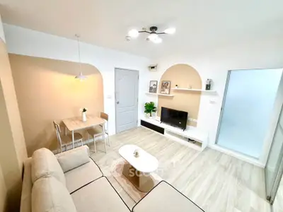 Modern living room with stylish decor and cozy seating area, perfect for relaxation and entertainment.