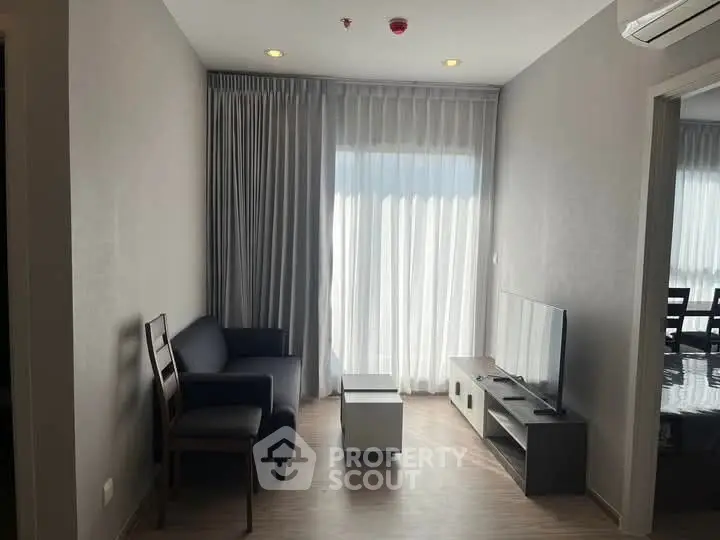 Modern living room with sleek furniture and natural light