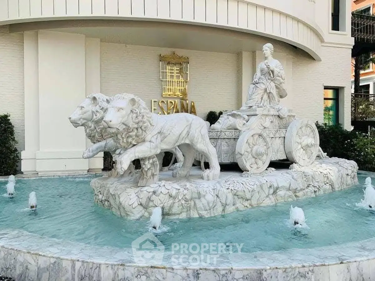 Elegant marble fountain with classical statue at luxury property entrance