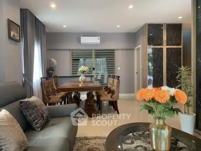Elegant living and dining area with stylish furniture and modern decor