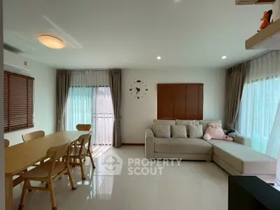 Spacious living room with modern decor and natural light