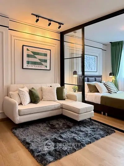 Modern living room with cozy sofa and stylish bedroom view