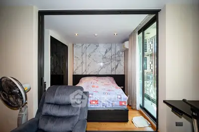 Modern bedroom with sliding glass doors and cozy decor