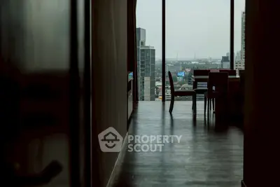 Modern high-rise apartment with stunning city view and sleek interior design.