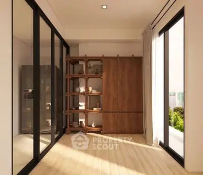 Spacious modern room with wooden flooring and large windows offering natural light and scenic views.