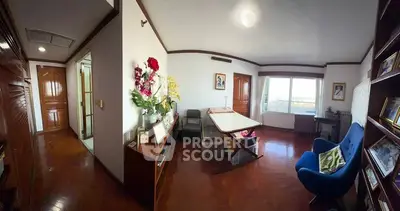 Spacious study room with elegant decor and large window view