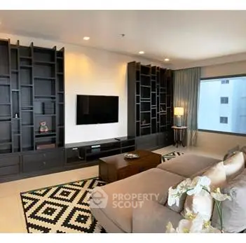 Spacious modern living room with stylish shelving and cozy seating area