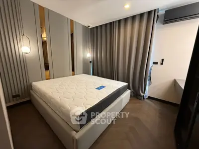 Modern bedroom with stylish lighting and elegant curtains