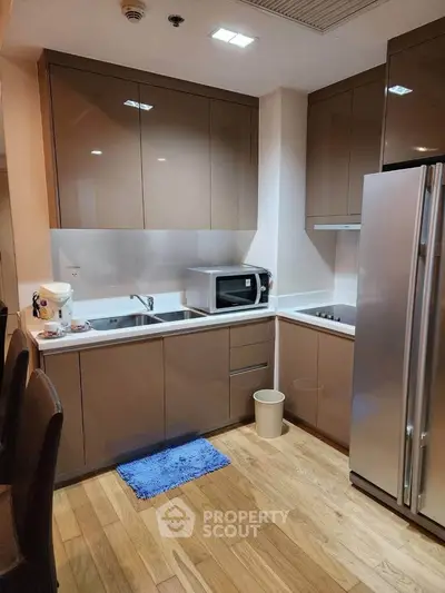 Modern kitchen with sleek cabinets and stainless steel appliances