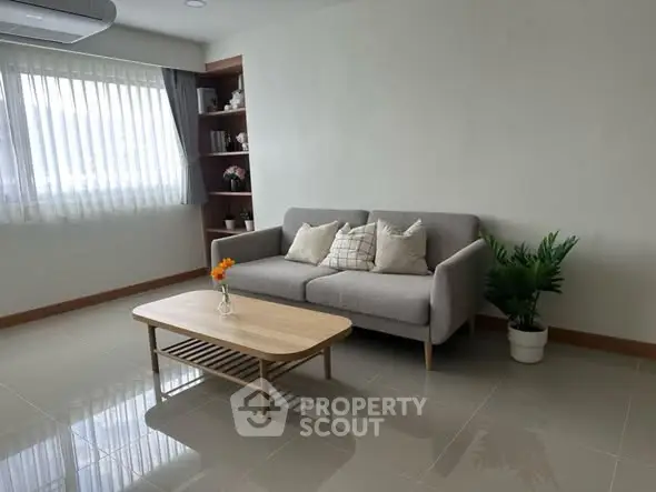 Modern living room with cozy sofa and natural light
