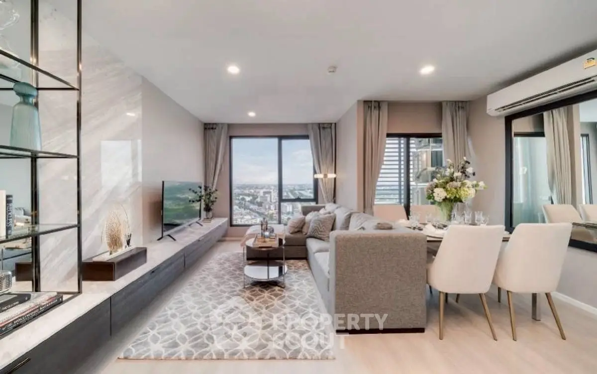 Modern living room with elegant decor and city view, featuring cozy seating and stylish dining area.