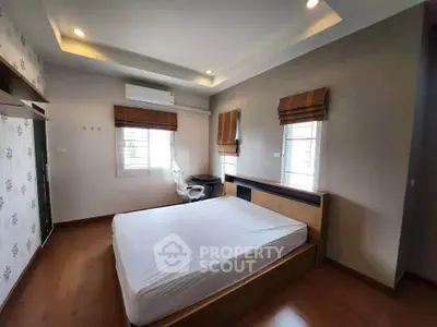 Spacious bedroom with modern design and natural light