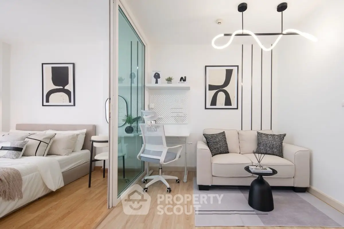 Modern studio apartment with stylish decor and functional workspace