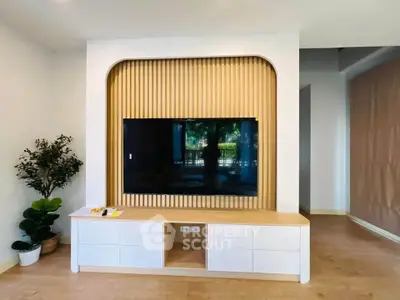 Modern living room with stylish TV unit and elegant decor