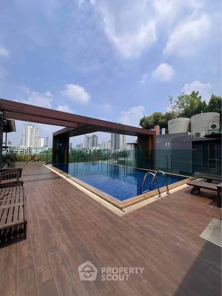 Luxurious rooftop pool with stunning city skyline views, perfect for relaxation and leisure in a modern urban setting.