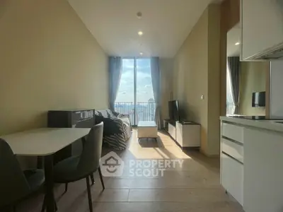 Modern living room with panoramic city view, stylish furniture, and natural light.