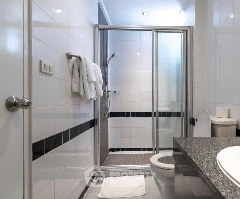 Modern bathroom with glass shower and sleek design