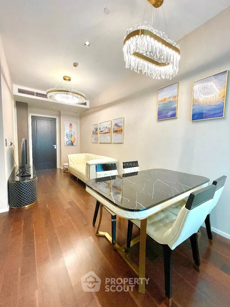 Luxurious living room with elegant chandeliers and modern decor