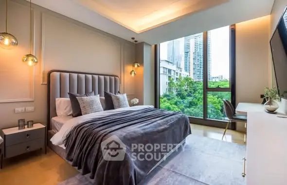 Luxurious bedroom with modern decor and large window offering stunning city view.
