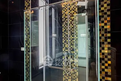 Luxurious modern bathroom with glass shower and stylish tile design