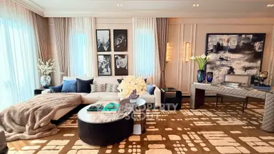 Luxurious living room with elegant decor, plush seating, and modern art, perfect for sophisticated living.