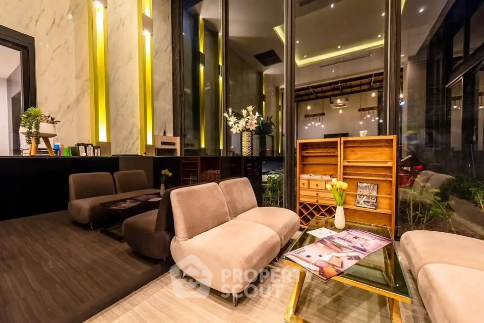 Luxurious modern living room with elegant decor and large windows in a high-end property.
