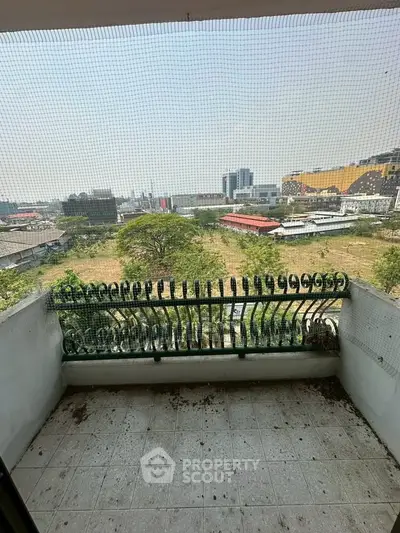 Charming balcony with expansive city view, perfect for relaxation and enjoying urban landscapes.