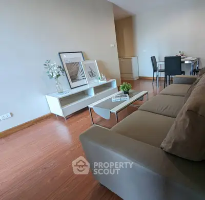 Modern living room with stylish decor and wooden flooring