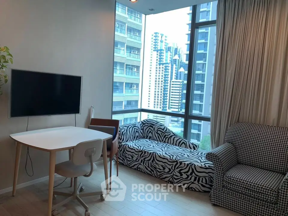 Modern living room with stylish furniture and city view from large windows