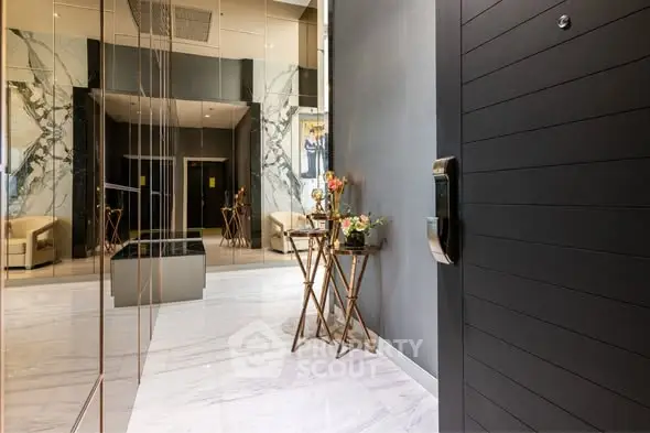 Luxurious apartment entrance with marble floors and elegant decor