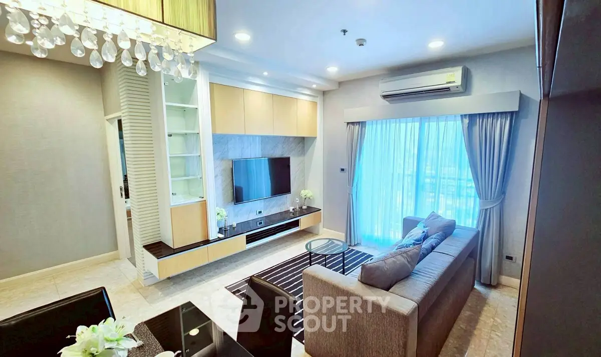 Luxurious living room with modern decor, large window, and elegant lighting in a high-end apartment.